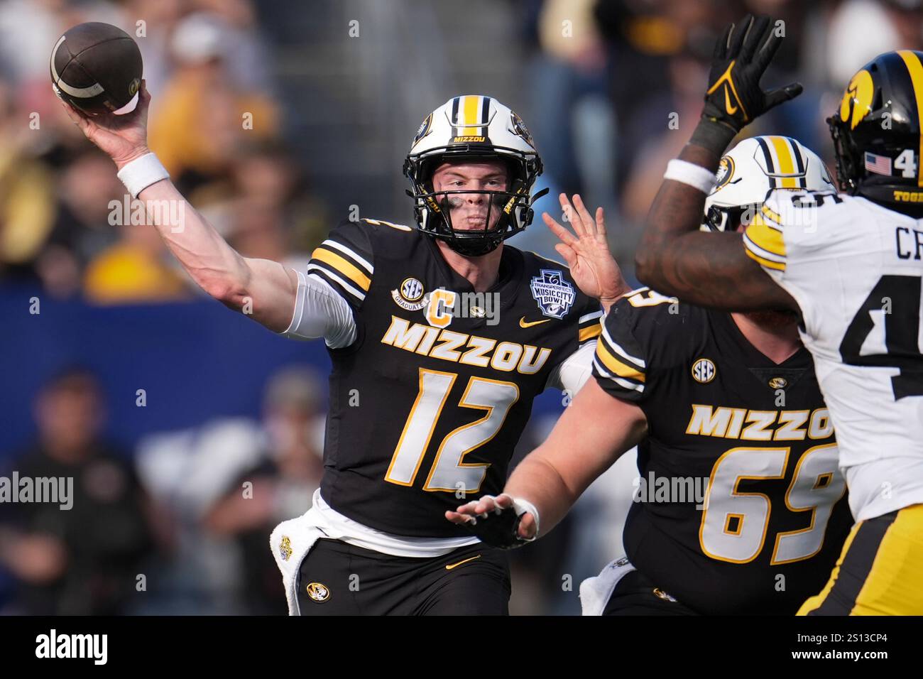Missouri quarterback Brady Cook (12) throws a pass during the first