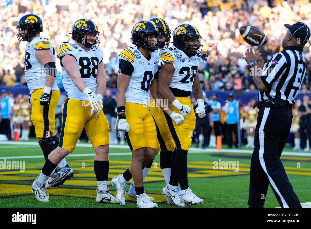 The Iowa Hawkeyes celebrate after a touchdown scored by running back