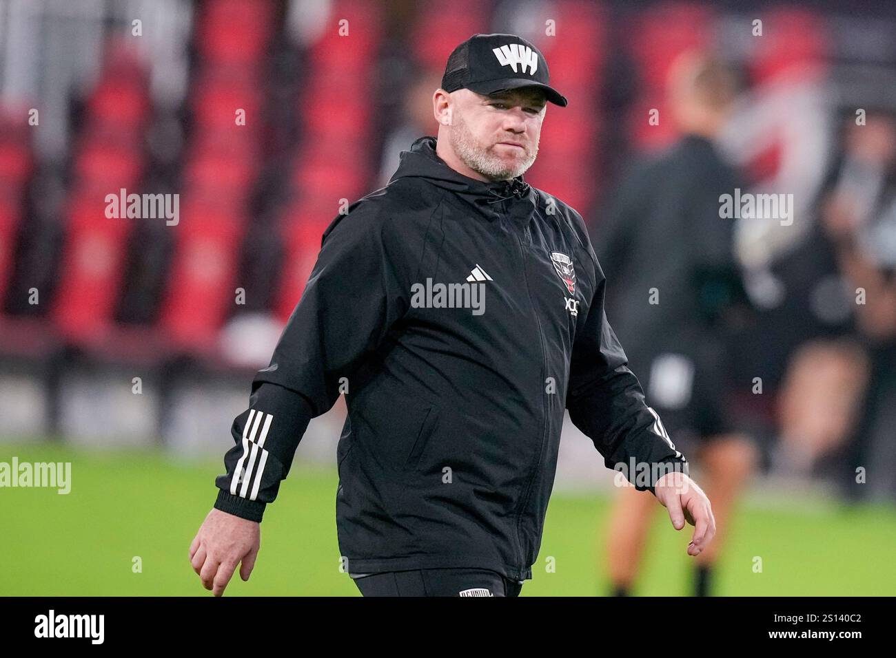 FILE - Then D.C. United head coach Wayne Rooney walks off the field ...