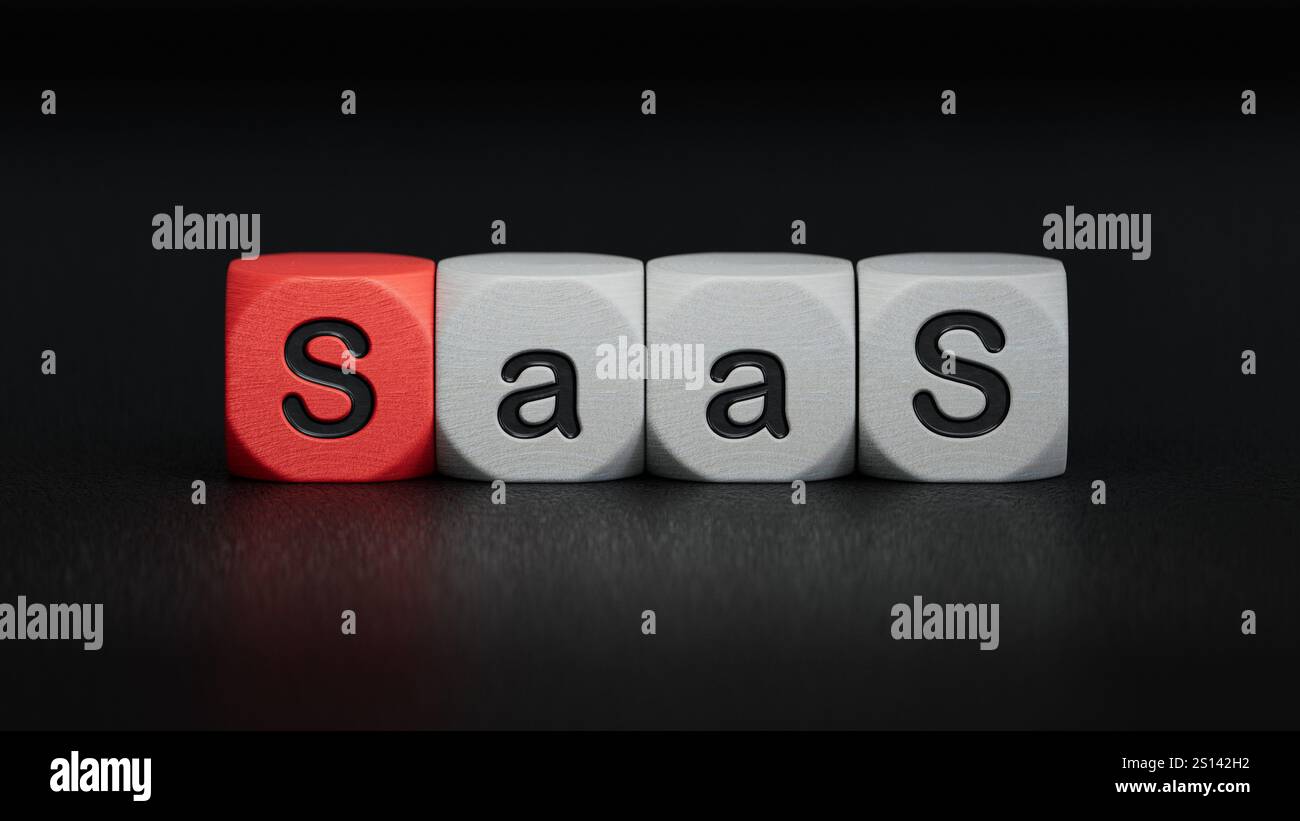 wooden cube block with SAAS business word.close up of wooden elements,Business Concept.3D rendering on black background. Stock Photo
