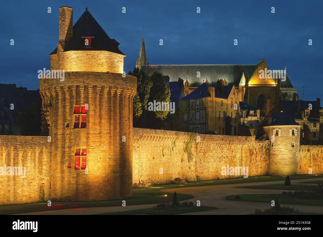 Illuminated city wall of Vannes at night, France, Brittany, Vannes Stock Photo