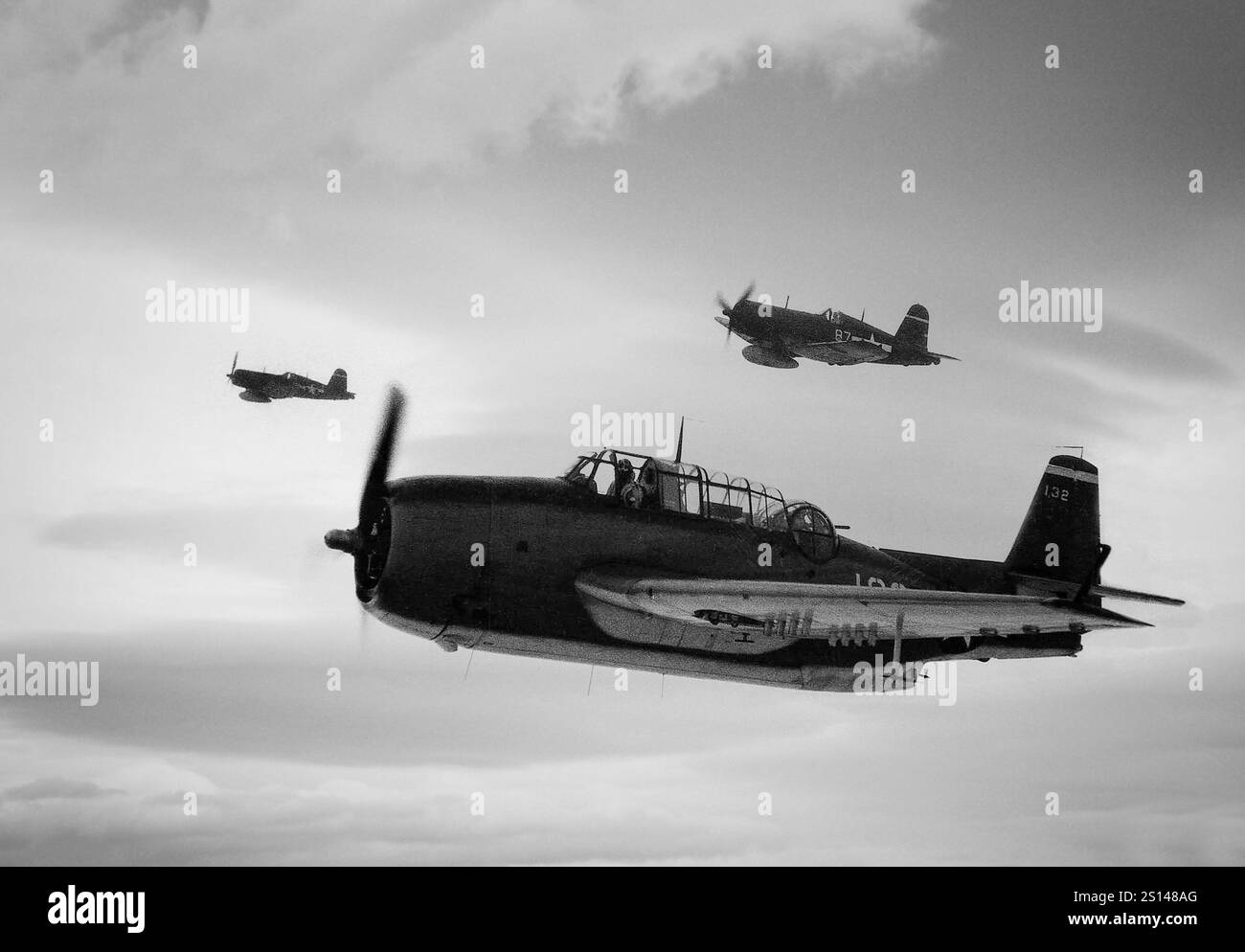 Grumman TBF Avengers from USS Essex in flight. An American World War II-era torpedo bomber developed initially for the United States Navy and Marine Corps, but eventually used by several air and naval aviation services around the world. It entered U.S. service in 1942, and first saw action during the Battle of Midway. Despite the loss of five of the six Avengers on its combat debut, it survived in service to become the most widely-used torpedo bomber of World War II. Stock Photo