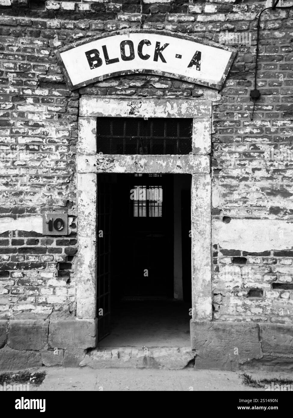 Entrance door to the prison block A at Terezin concentration camp, Czech Republic. Black and white image. Stock Photo