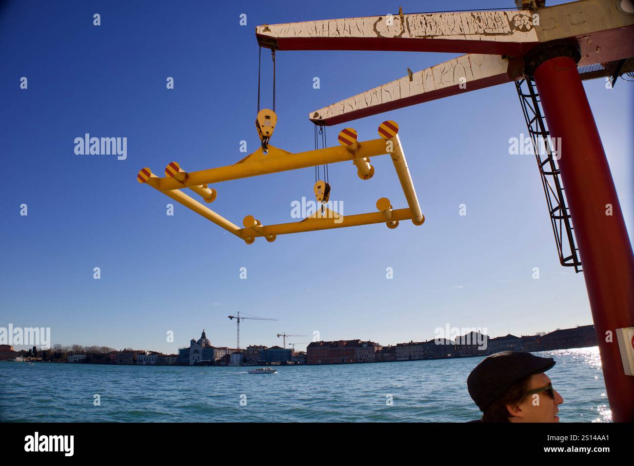 Venice, Italy. December 26, 2024. Crane and horizon of a bay. Stock Photo