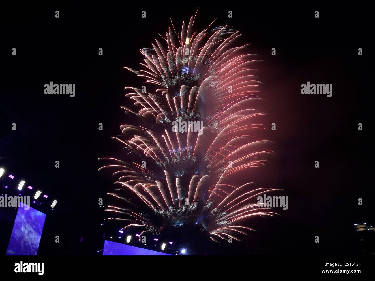 Fireworks explode from the Taipei 101 building during the New Year's