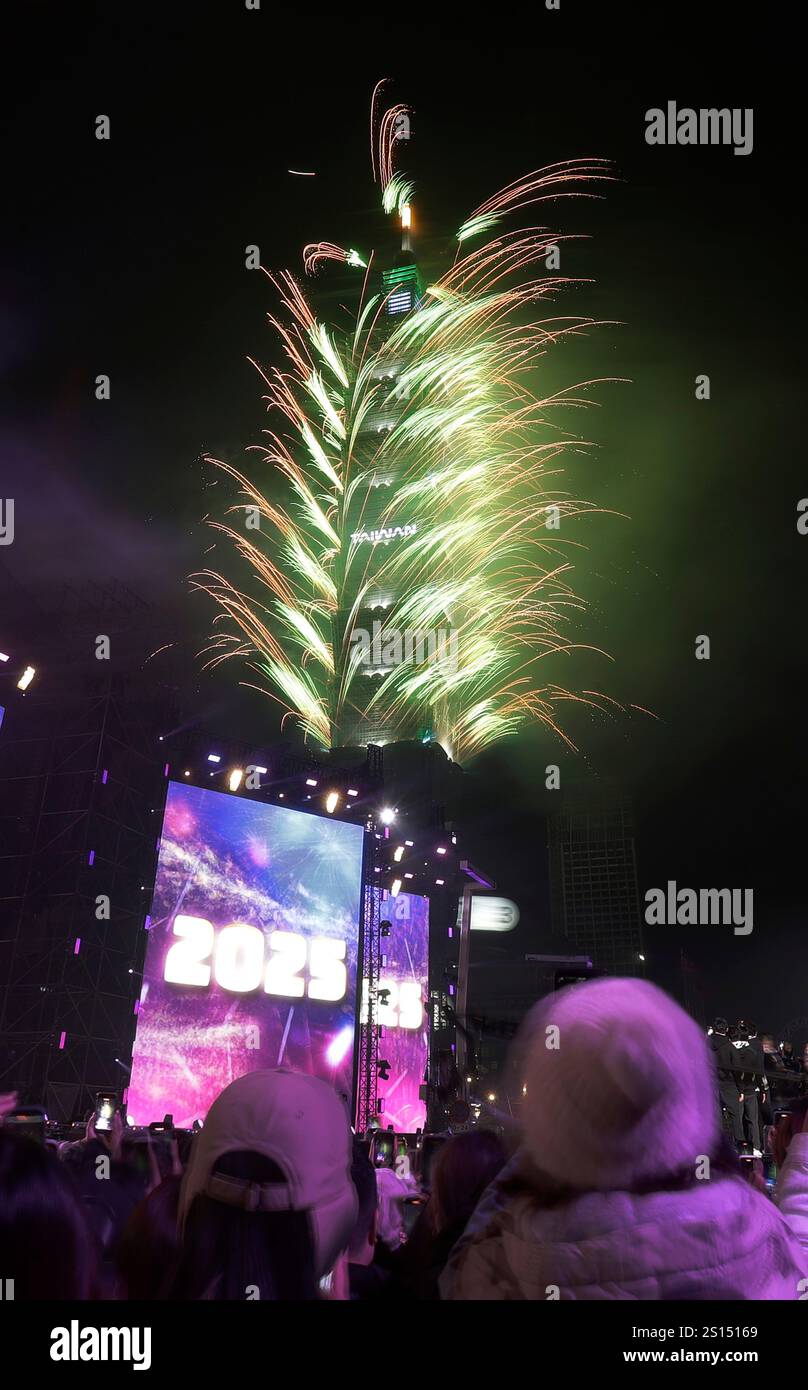 Fireworks explode from the Taipei 101 building during the New Year's