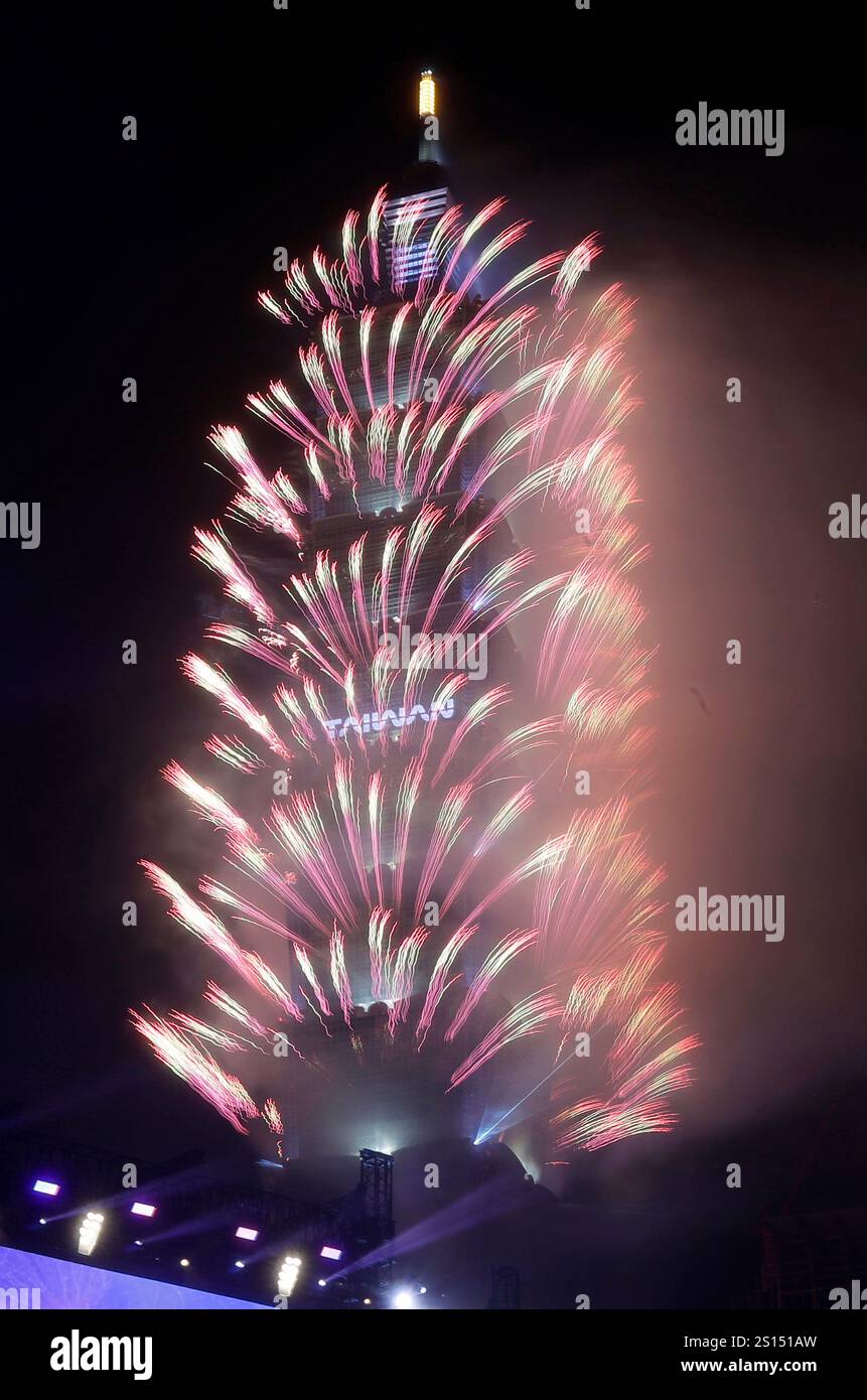 Fireworks explode from the Taipei 101 building during the New Year's