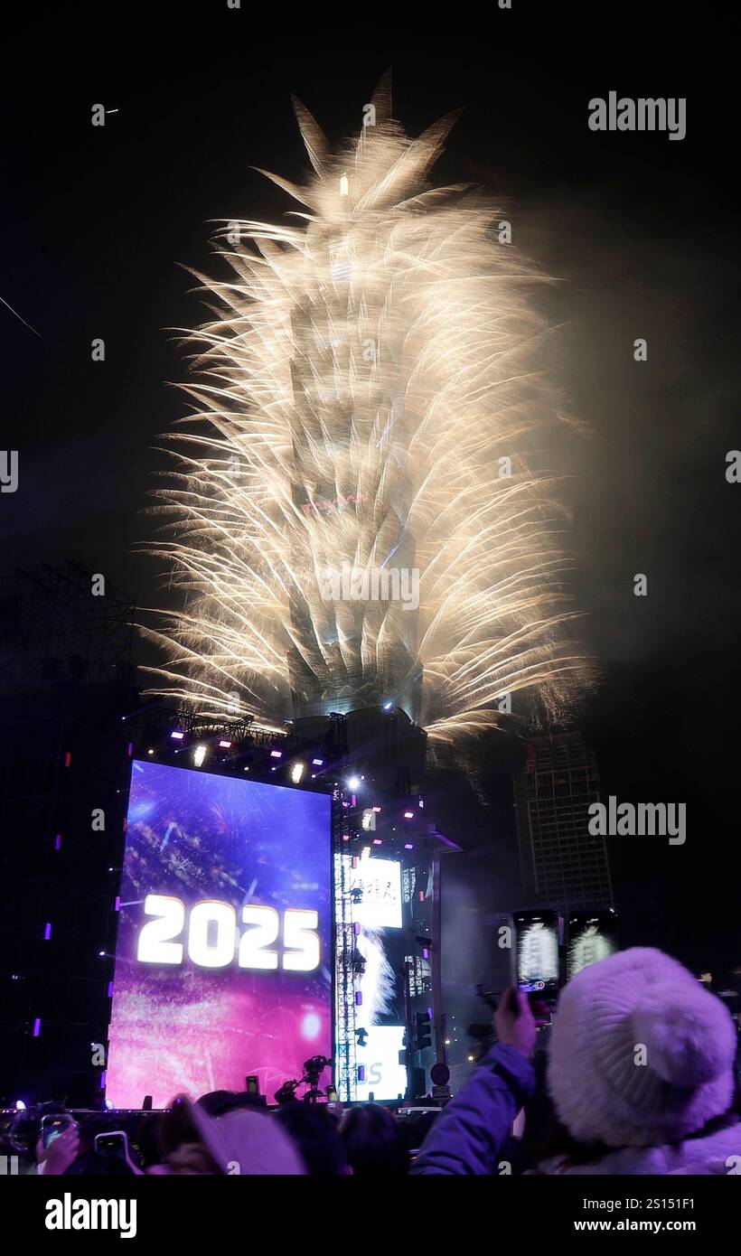 Fireworks explode from the Taipei 101 building during the New Year's