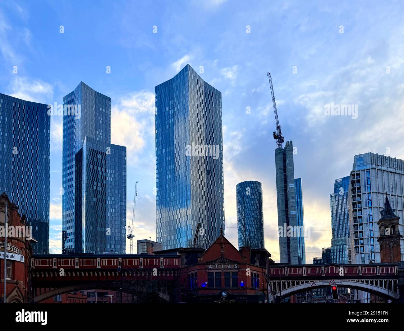 Deansgate railway station, Manchester. Original rail bridge contrasted against new towers of the Deansgate Square complex - Smartphone Captured Stock Image