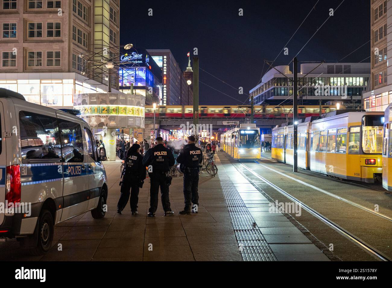 31 December 2024, Berlin: Police officers guard Alexanderplatz square