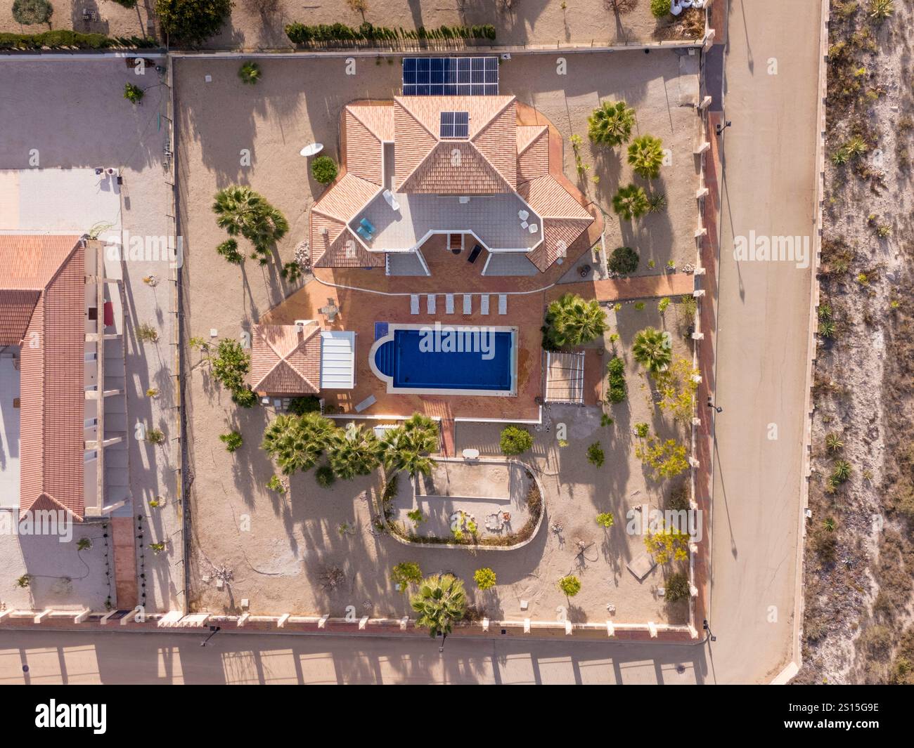 Bird eye view of a Mediterranean-style villa featuring a private pool ...