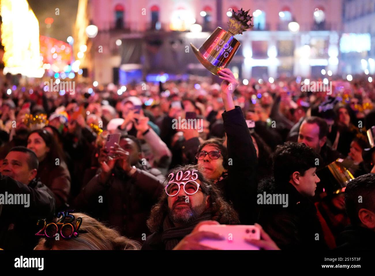 People celebrate during New Year's celebrations at Madrid's Puerta del ...