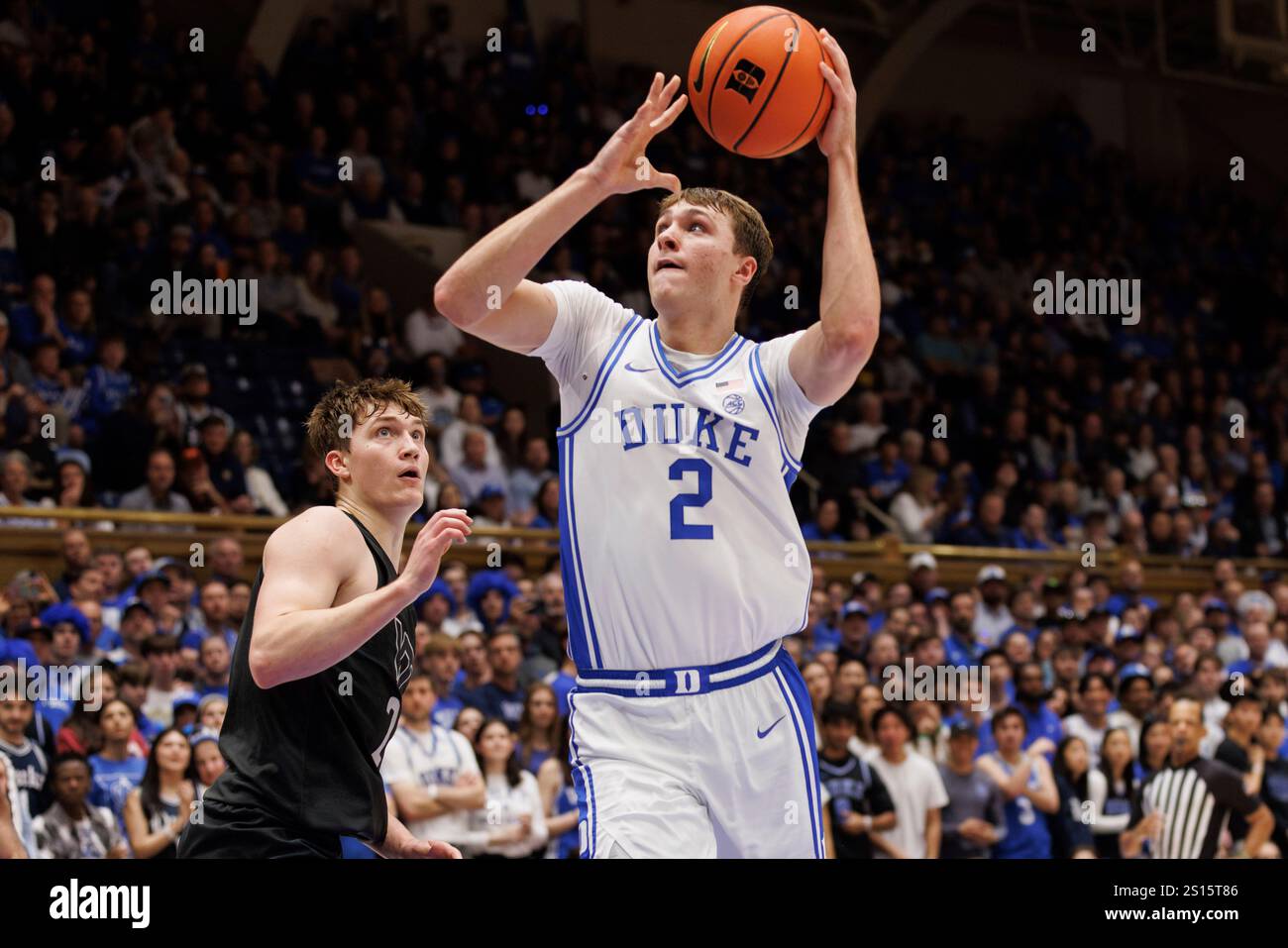 Duke's Cooper Flagg, right, attempts a shot ahead of Virginia Tech's ...