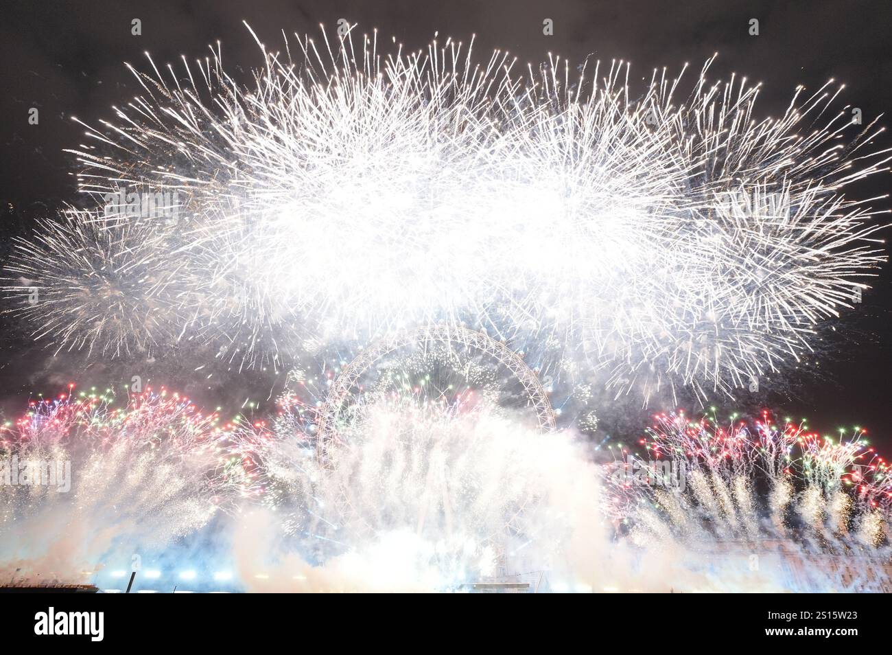 Fireworks light up the sky over the London Eye in central London during