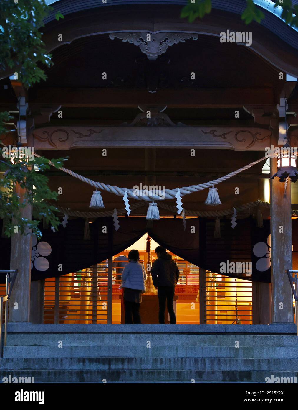 Worshipers pay the New Year's first visit to Suzujina Shrine in Suzu