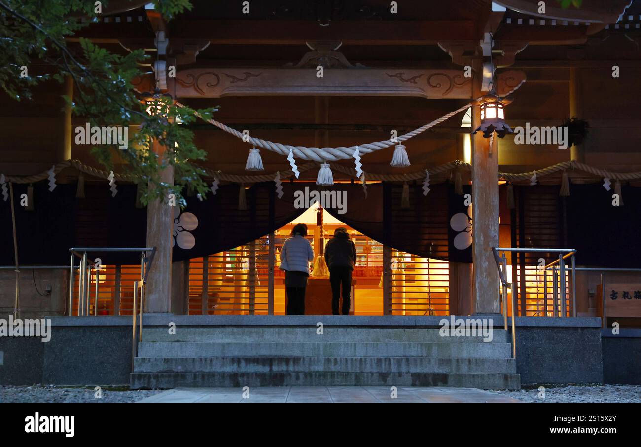 Worshipers pay the New Year's first visit to Suzujina Shrine in Suzu