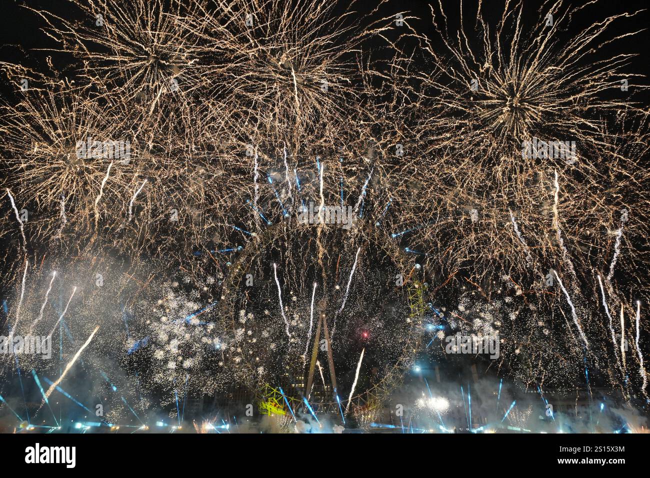 Fireworks light up the sky over the London Eye in central London during