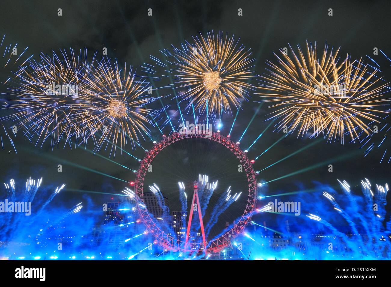 Fireworks light up the sky over the London Eye in central London during