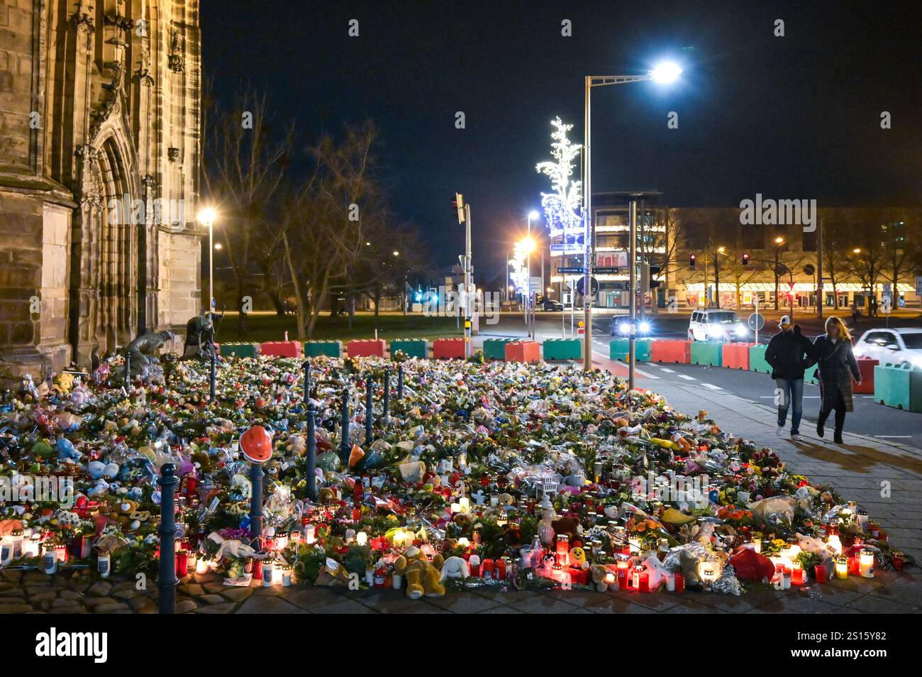 31 December 2024, Saxony-Anhalt, Magdeburg: On New Year's Eve, people