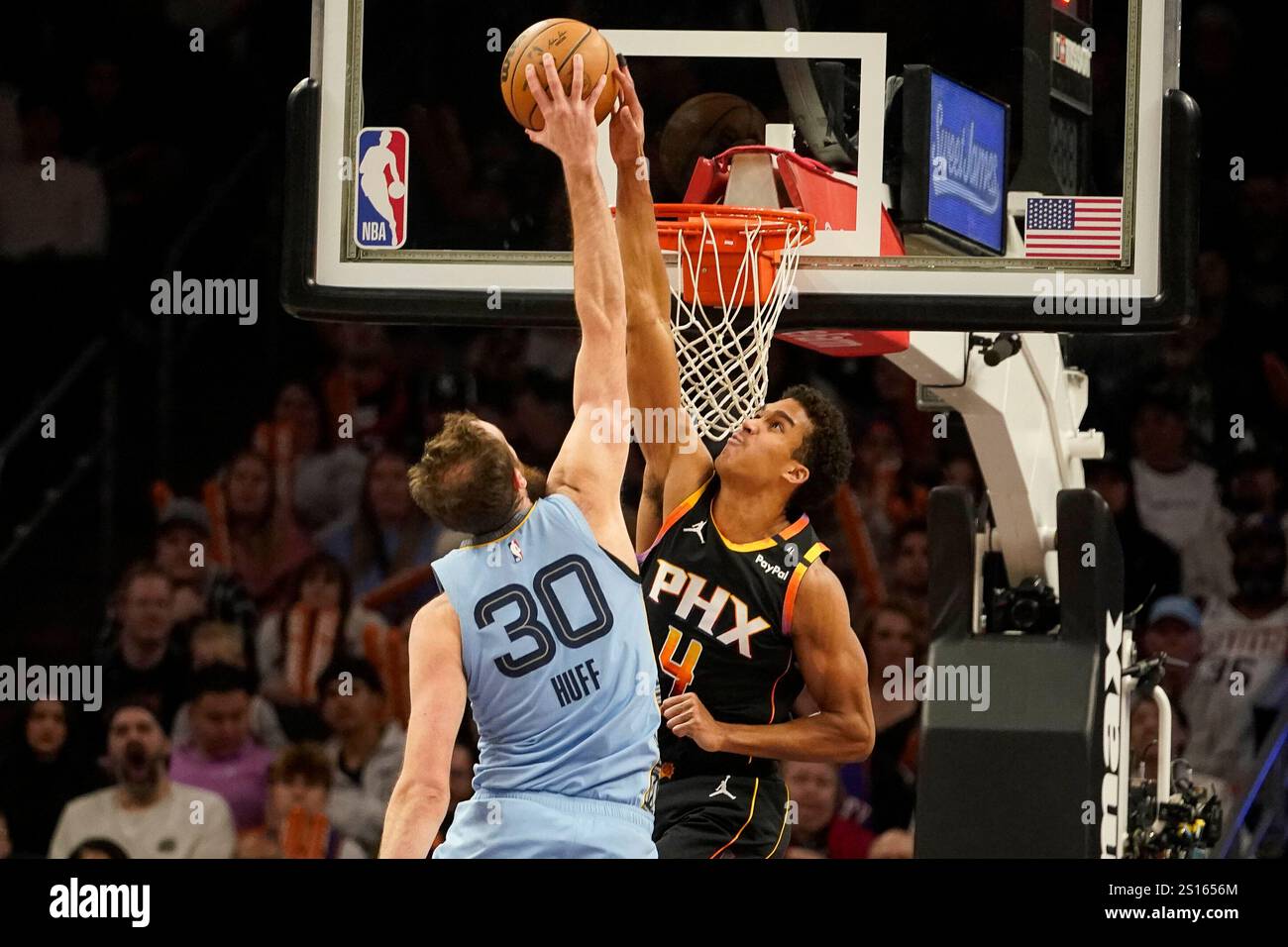 Phoenix Suns center Oso Ighodaro (4) blocks a shot by Memphis Grizzlies ...