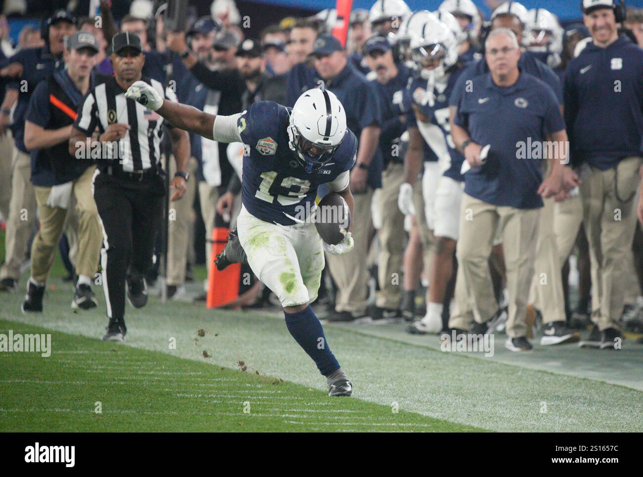 Glendale, United States. 31st Dec, 2024. Penn State running back Kaytron Allen (13) tries to stay in bounds on a long gain against Boise State in the third quarter of the Vrbo Fiesta Bowl at State Farm Stadium in Glendale, Arizona on Tuesday, December 31, 2024. Penn State defeated Boise State 31-14 and advances to the semi-finals of the College Football Playoff's. Photo by Bob Strong/UPI Credit: UPI/Alamy Live News Stock Photo