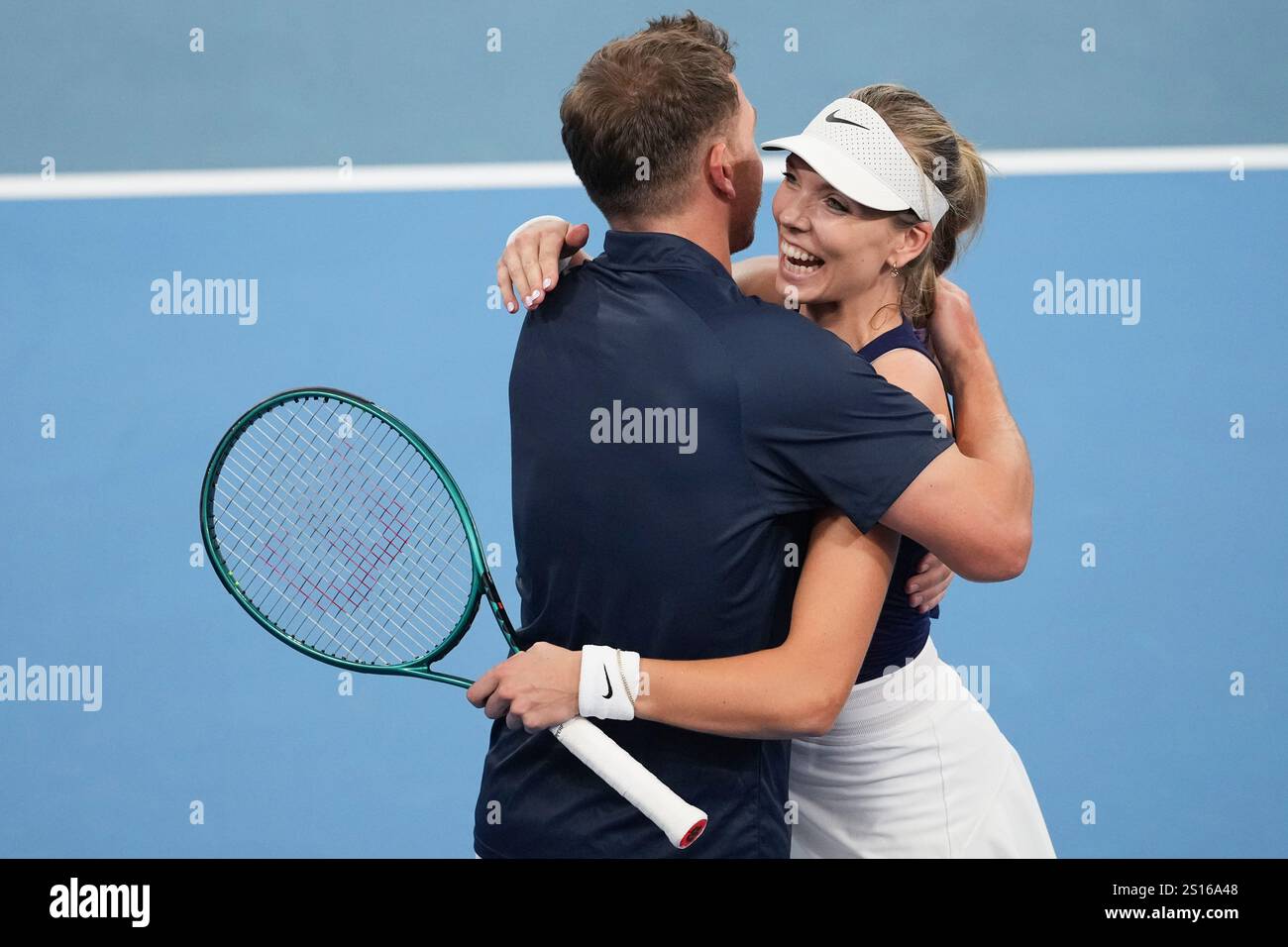 Britain's Katie Boulter is congratulated by Britain's captain Alex Ward