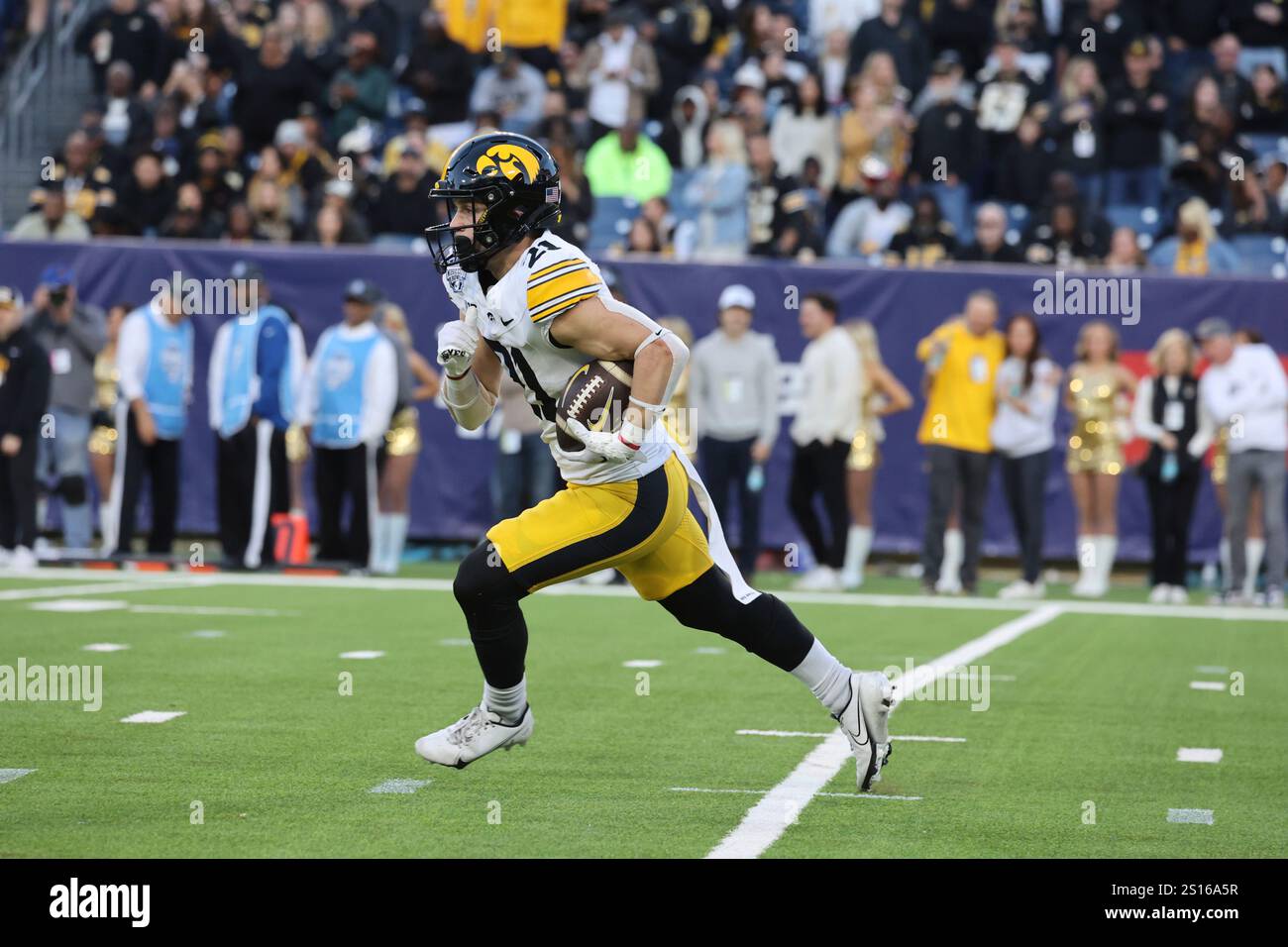 NASHVILLE, TN - DECEMBER 30: Jaxon Rexroth (12) of Iowa returns a kick ...