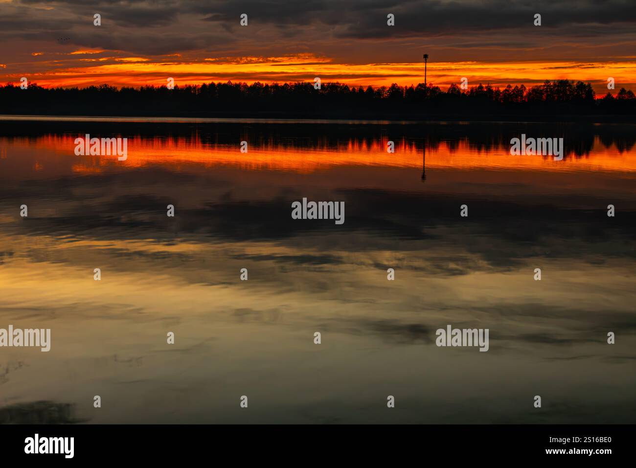 A Stunning Sunset Reflection Over Calm Waters In A Beautiful, Serene ...