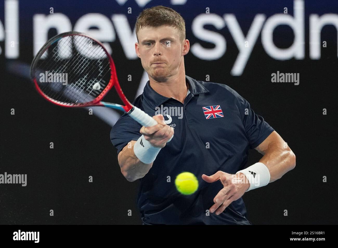 iBritain's Billy Harris plays a forehand return to Australia's Alex de