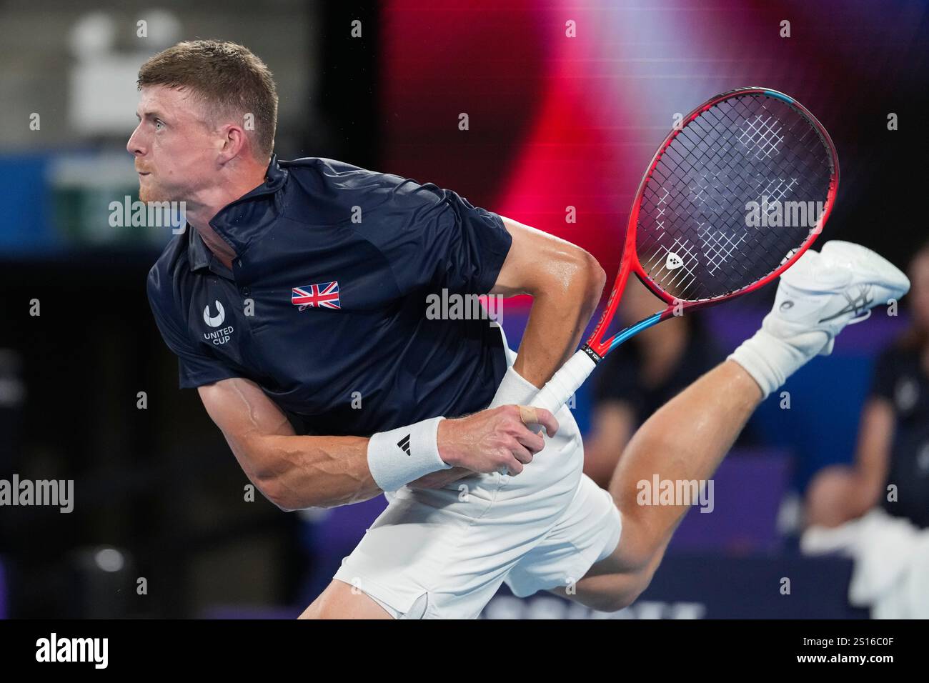 Britain's Billy Harris serves to Australia's Alex de Minaur during