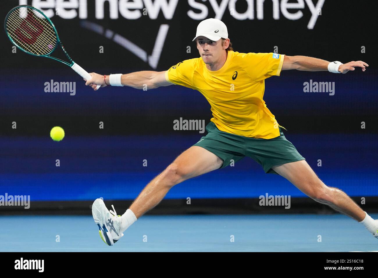 Australia's Alex de Minaur plays a forehand return to Britain's Billy