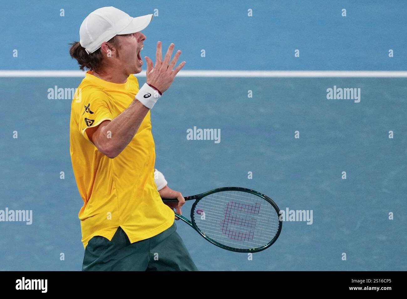 Australia's Alex de Minaur reacts after winning a point against Britain