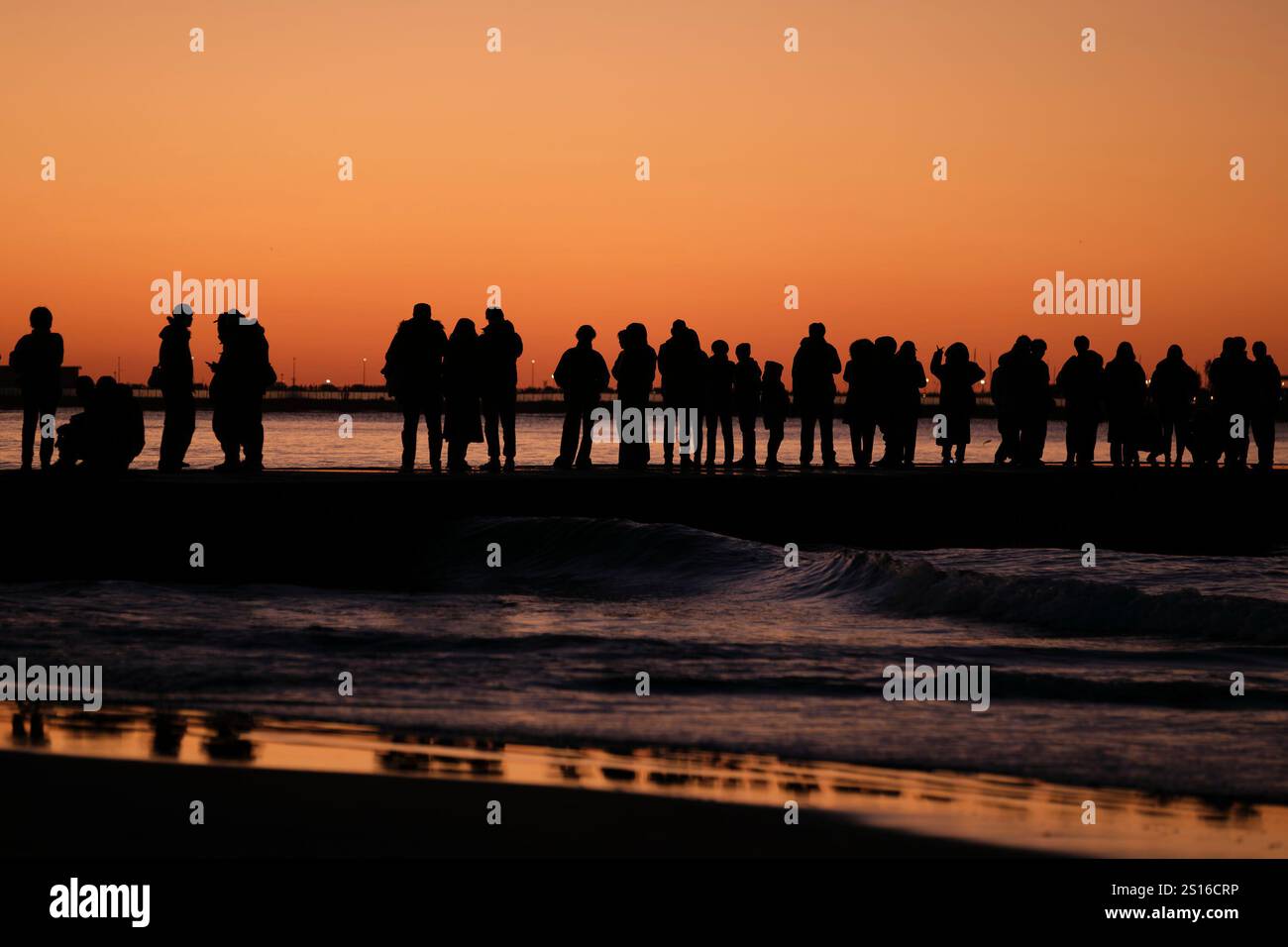 JANUARY 1, 2025 People gather to watch the first sunrise of the new