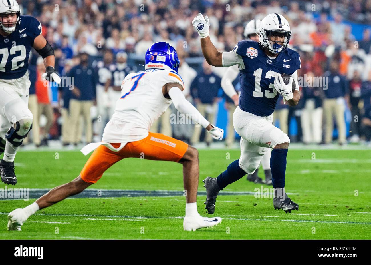 Glendale, Arizona, USA. December 31 2024 Glendale, AZ U.S.A. Penn State running back Kaytron Allen (13) runs to the outside for a first down during the NCAA Vrbo Fiesta Bowl Playoff Quarterfinal football game between Penn State Nittany Lions and the Boise State Broncos. Penn State beat Boise State 31-14 at State Farm Stadium Glendale, AZ Thurman James/CSM Credit: Cal Sport Media/Alamy Live News Stock Photo