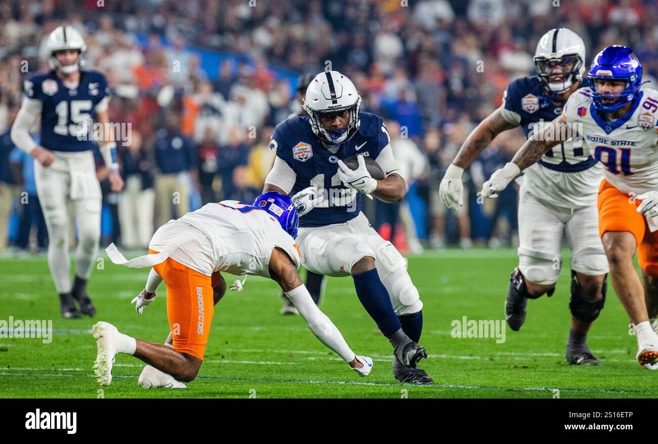 Glendale, Arizona, USA. December 31 2024 Glendale, AZ U.S.A. Penn State running back Kaytron Allen (13) tries to avoid from being tackle during the NCAA Vrbo Fiesta Bowl Playoff Quarterfinal football game between Penn State Nittany Lions and the Boise State Broncos. Penn State beat Boise State 31-14 at State Farm Stadium Glendale, AZ Thurman James/CSM (Credit Image: © Thurman James/Cal Sport Media) Credit: Cal Sport Media/Alamy Live News Stock Photo