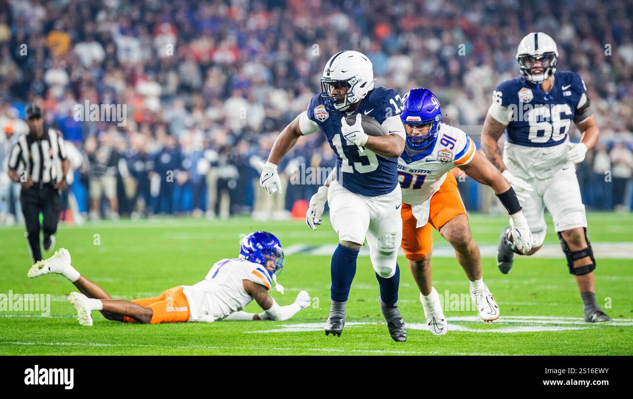 Glendale, Arizona, USA. December 31 2024 Glendale, AZ U.S.A. Penn State running back Kaytron Allen (13) tries to avoid from being tackle and runs for a long gain during the NCAA Vrbo Fiesta Bowl Playoff Quarterfinal football game between Penn State Nittany Lions and the Boise State Broncos. Penn State beat Boise State 31-14 at State Farm Stadium Glendale, AZ Thurman James/CSM (Credit Image: © Thurman James/Cal Sport Media) Credit: Cal Sport Media/Alamy Live News Stock Photo