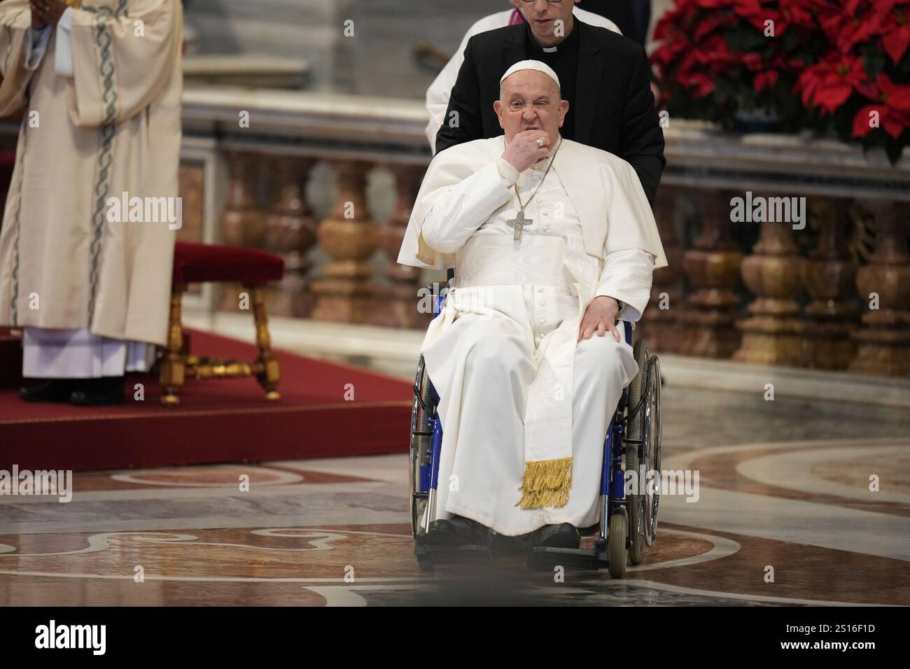 Pope Francis leaves at the end of a mass in St. Peter's Basilica at The