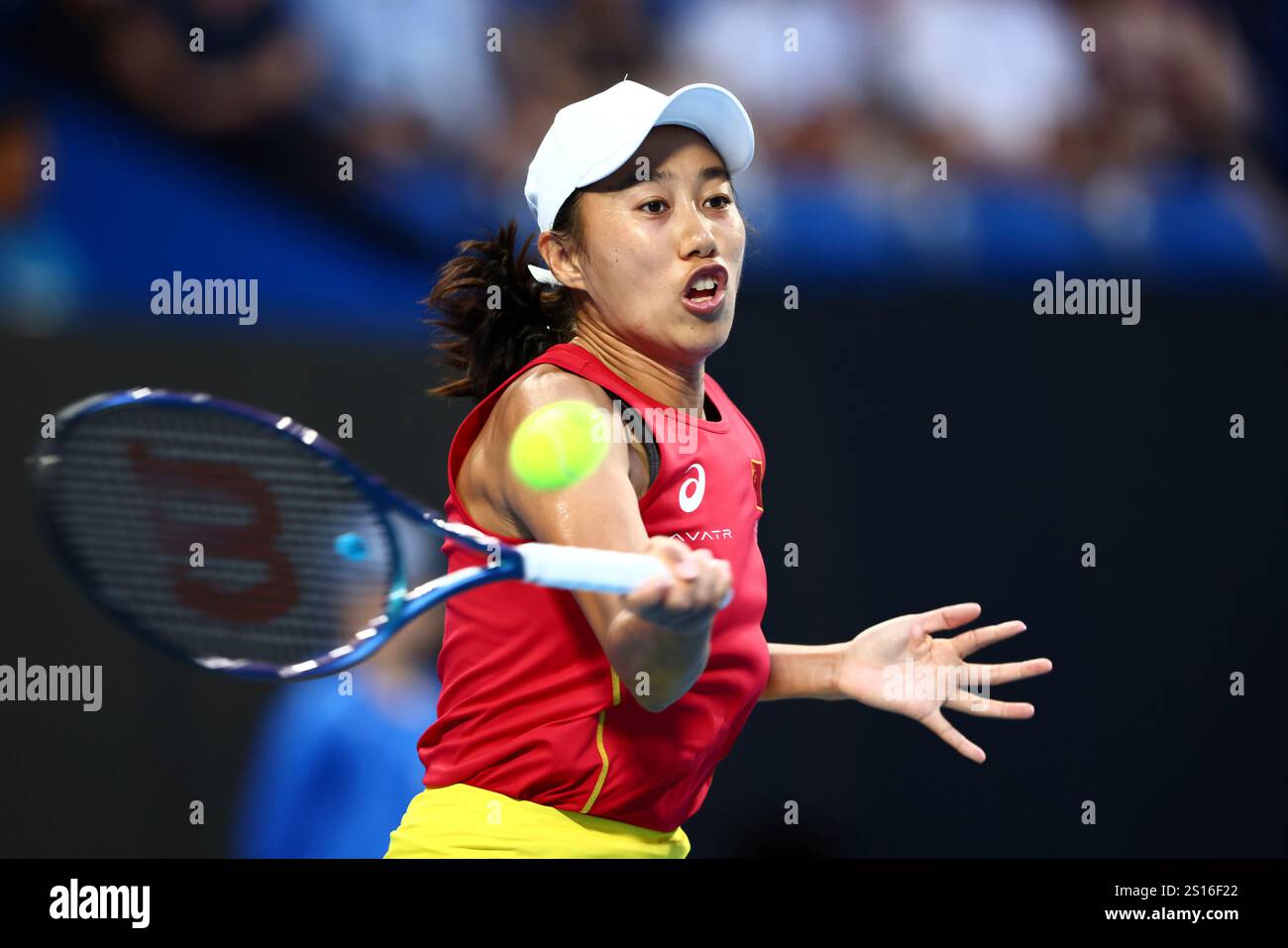 Shuai Zhang of China hits a return shot to Coco Gauff of the United