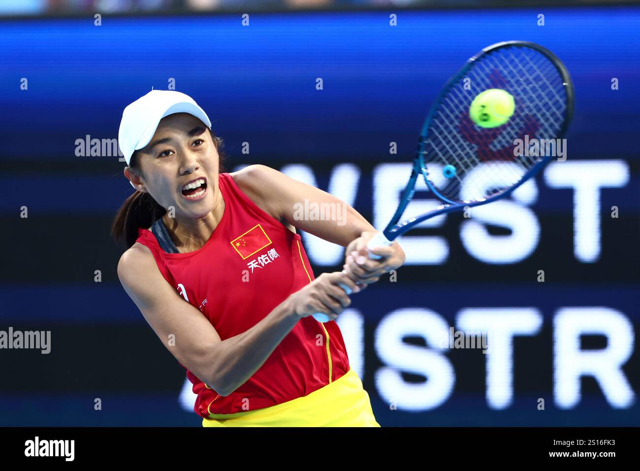 Shuai Zhang of China hits a return shot to Coco Gauff of the United
