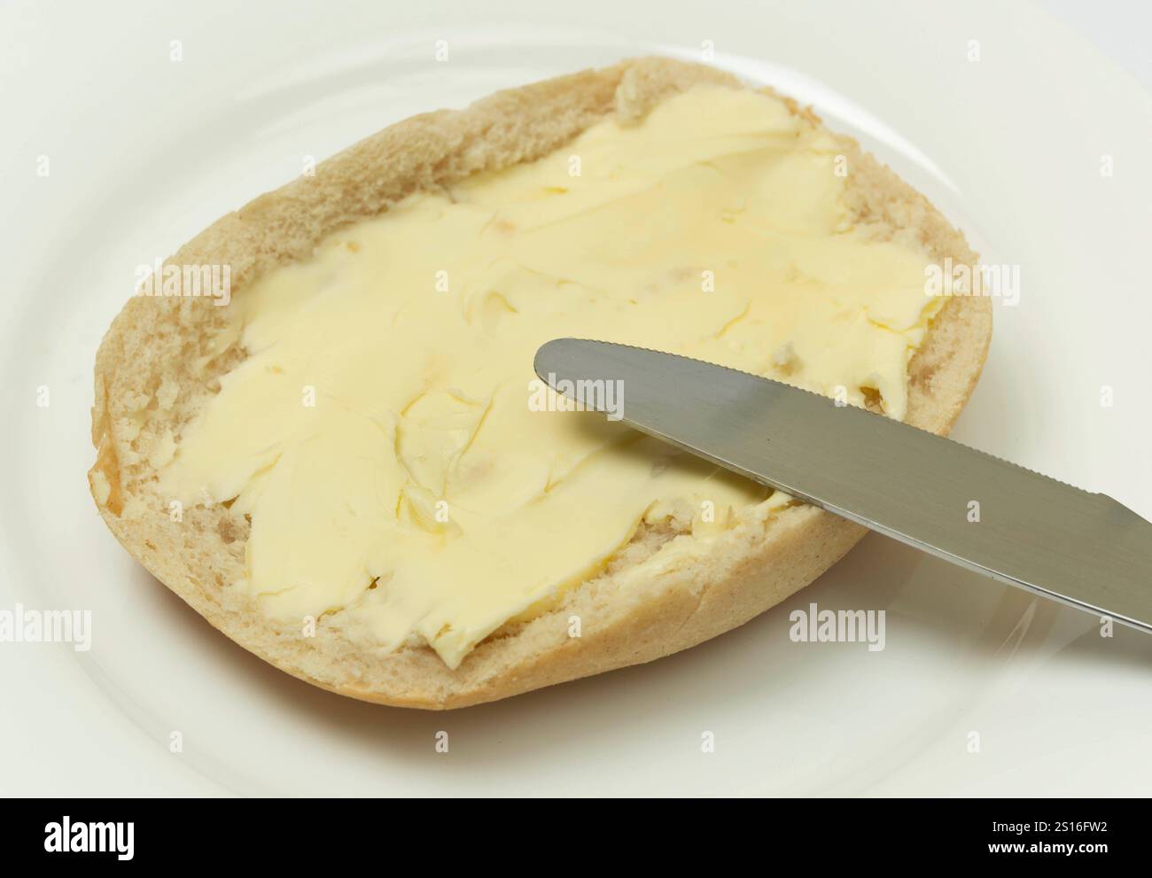 DEU , DEUTSCHLAND : Ein Broetchen Brötchen mit Butter / Butterbroetchen ...