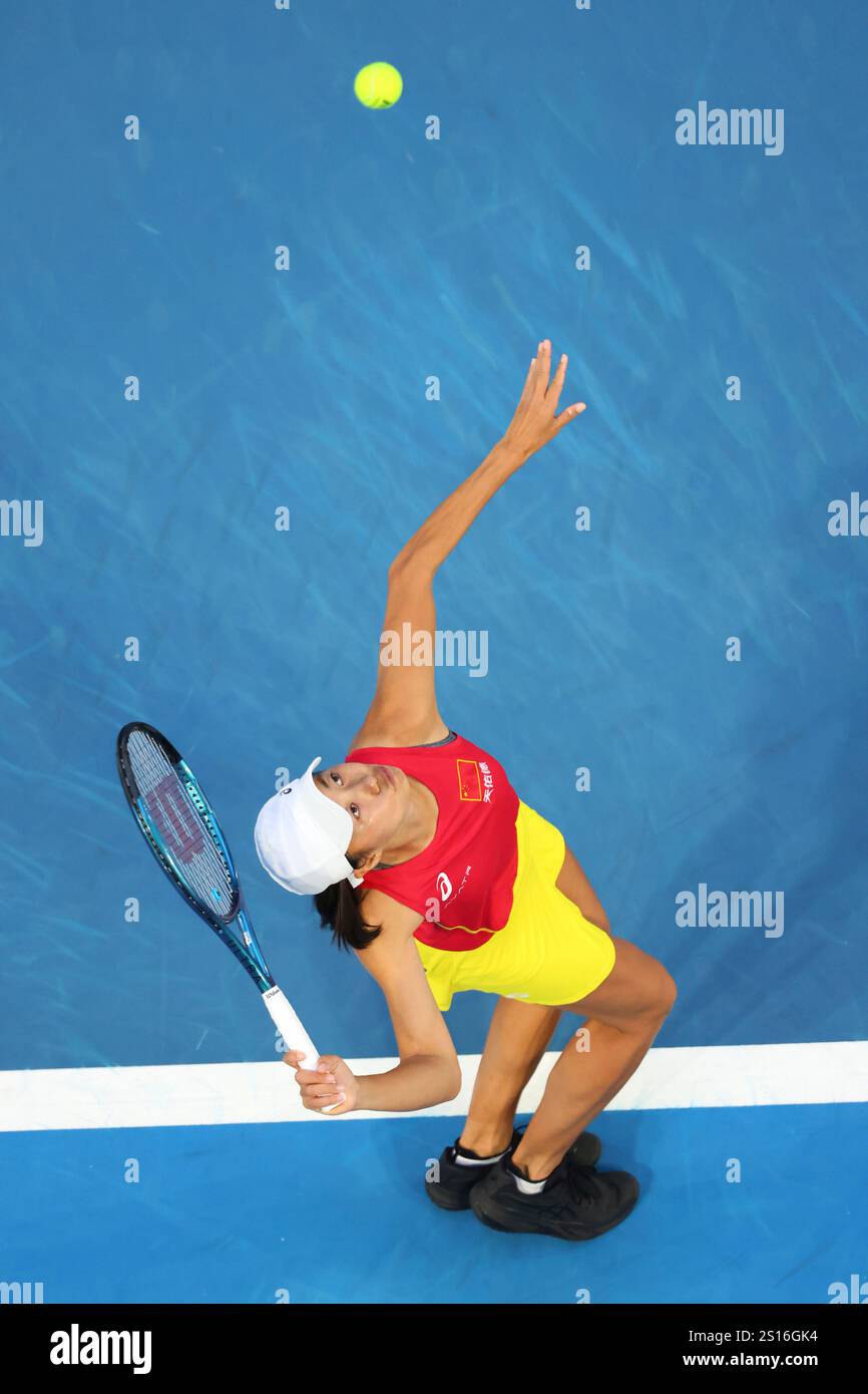 Shuai Zhang of China serves to Coco Gauff of the United States during