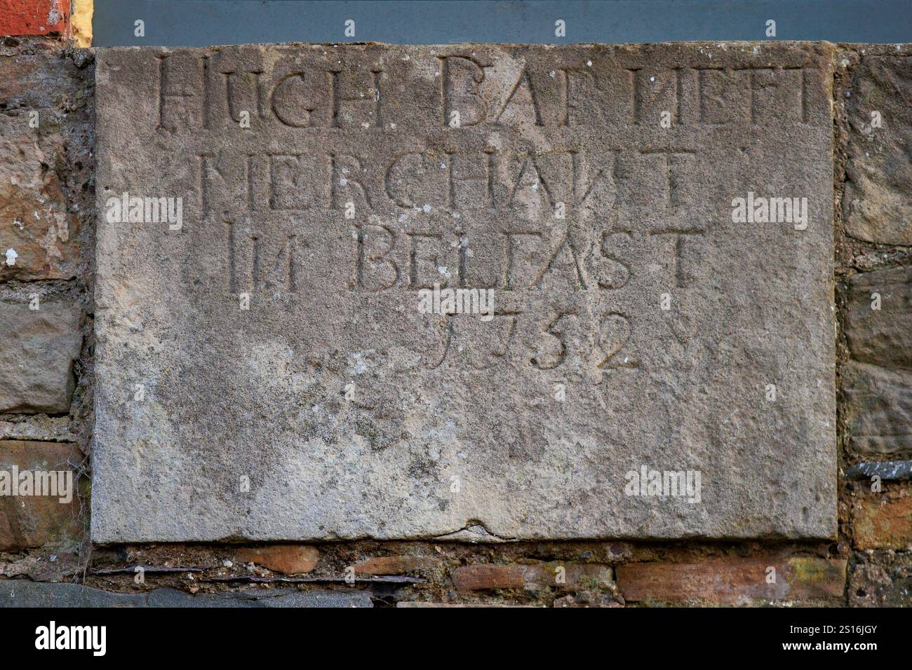 Datestone on the wall of Dundonald Old Mill, with the inscription of, Hugh Barnett, merchant in Belfast, 1752. The Old Mill is going through a major renovation and restoration of the 250-year-old buildings, with the near completed project being backed by chef Yotam Ottolenghi to transform the derelict 18th century mill into a destination restaurant. Picture date: Monday December 16, 2024. Stock Photo