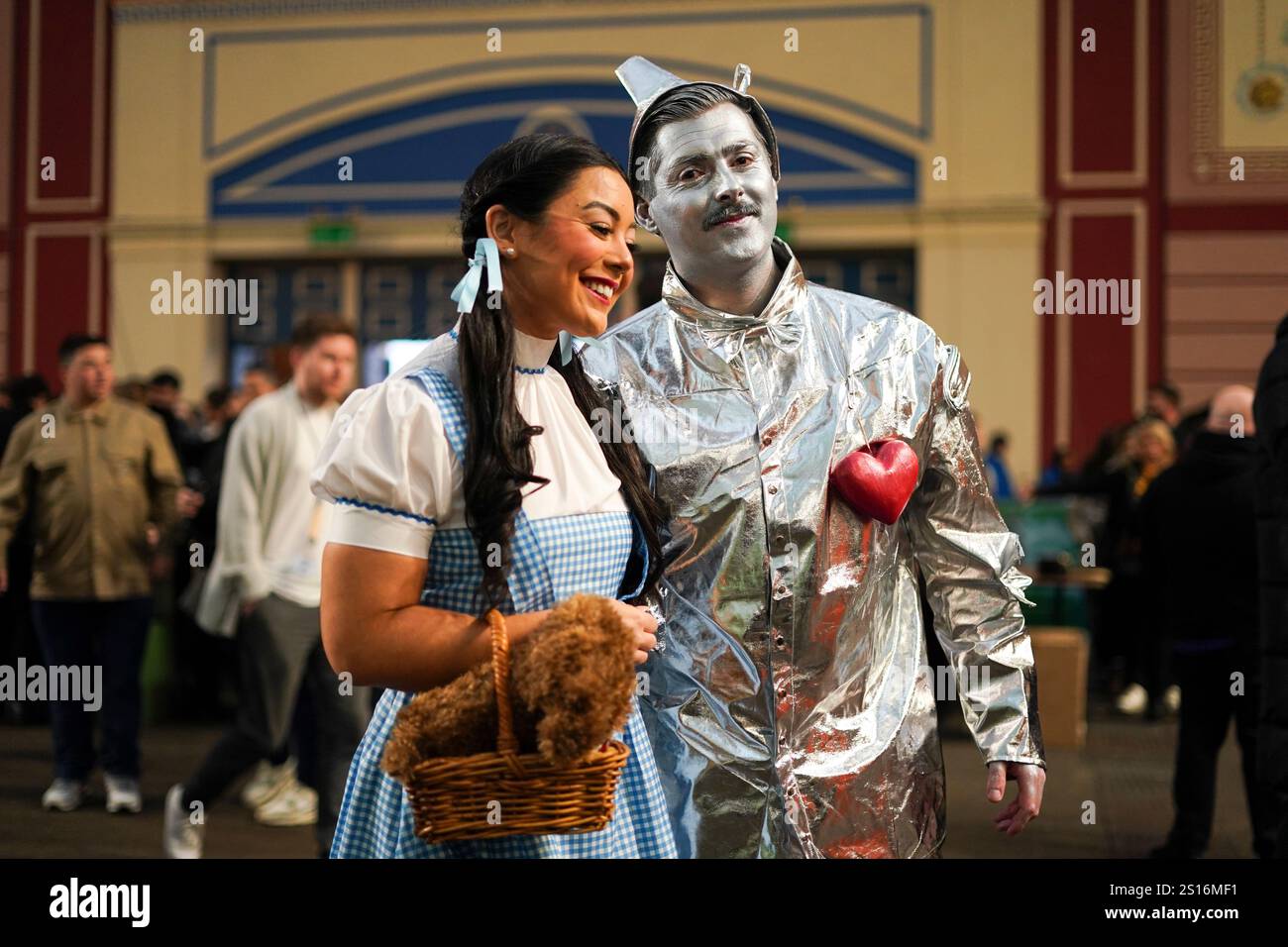 Fans dressed in costumes arrive for the start of the quarter final