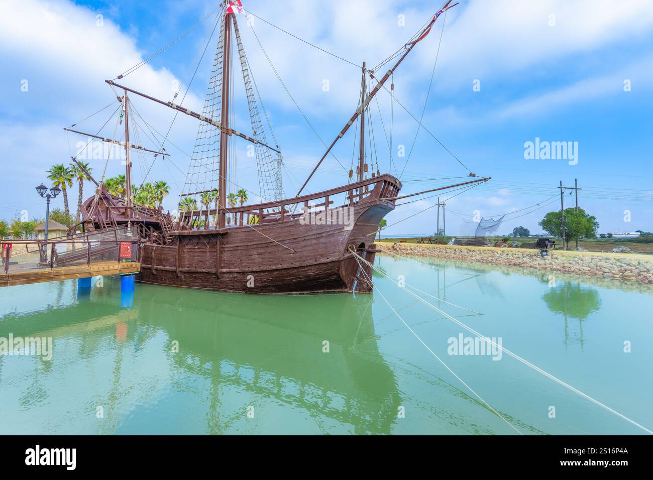 A detailed replica of Nina, a wooden caravel ship, docked at the ...