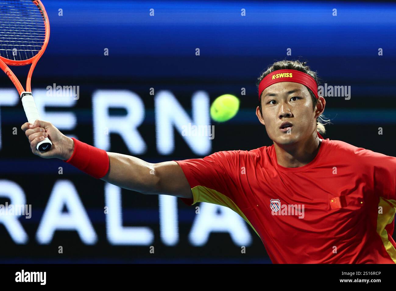 Zhizhen Zhang of China hits a return shot to Taylor Fritz of the United