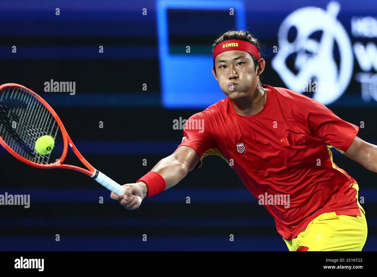 Zhizhen Zhang of China hits a return shot to Taylor Fritz of the United