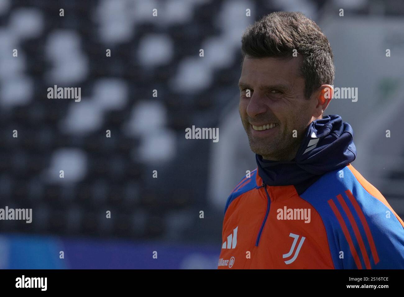 Juventus’ head coach Thiago Motta sign autographs as they enter the
