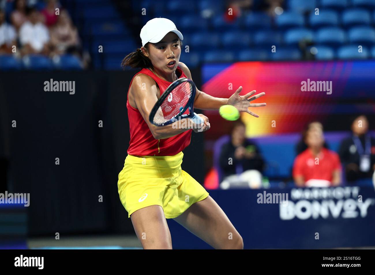 Shuai Zhang of China hits a return to Coco Gauff of the United States