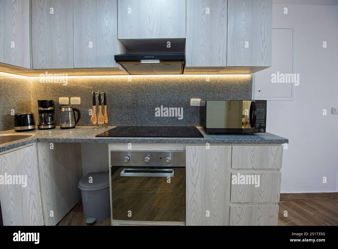 Kitchen area in luxury apartment show home showing open plan interior design decor furnishing Stock Photo