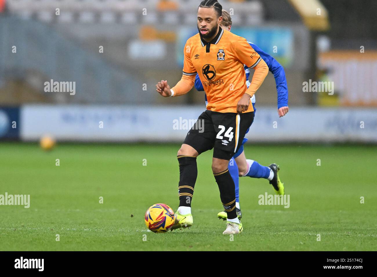 Jordan Cousins (24 Cambridge United) passes the ball during the Sky Bet